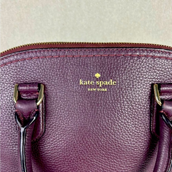 ♠️ Kate Spade Pebbled Leather McCall Street Carli Plum Doom Satchel with Tassel - Picture 9 of 16